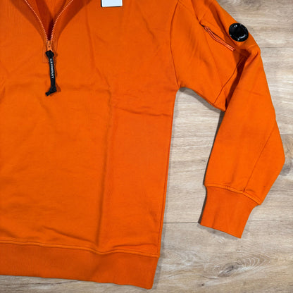 C.P. Company Diagonal Raised Half-Zip Lens Sweatshirt in Russet Orange