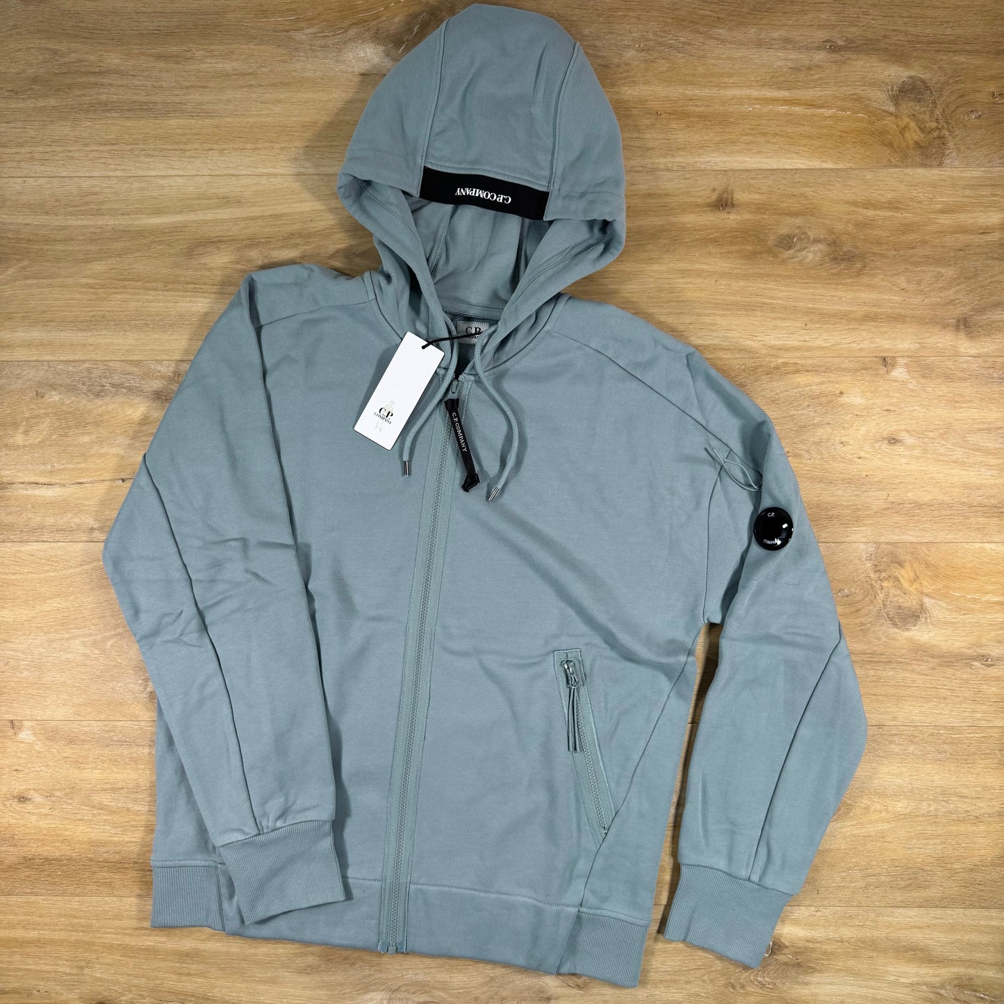 C.P. Company Diagonal Raised Zipped Lens Hoodie in Silver Blue