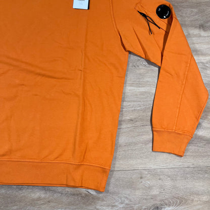 C.P. Company Light Fleece Crewneck Lens Sweatshirt in Russet Orange